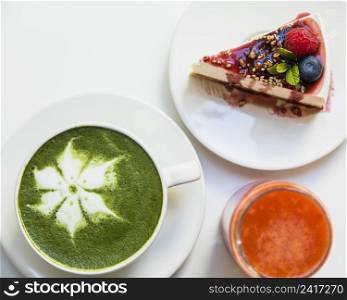 cheesecake with berries smoothie cup matcha latte art white background