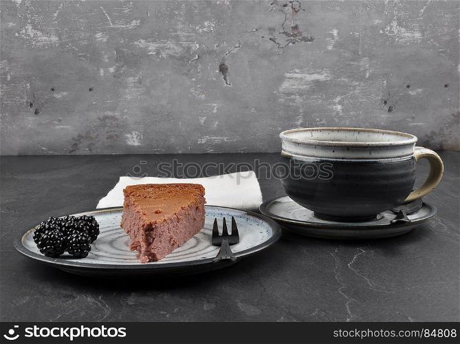 Cheesecake with blackberry on shale