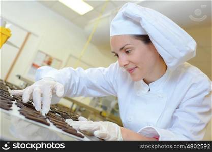 Chef arranging chocolates