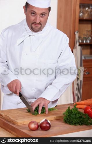 chef chopping herbs