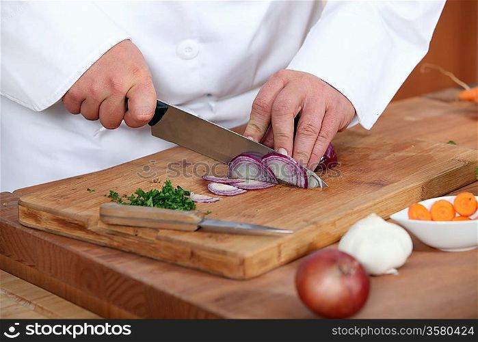Chef chopping onions