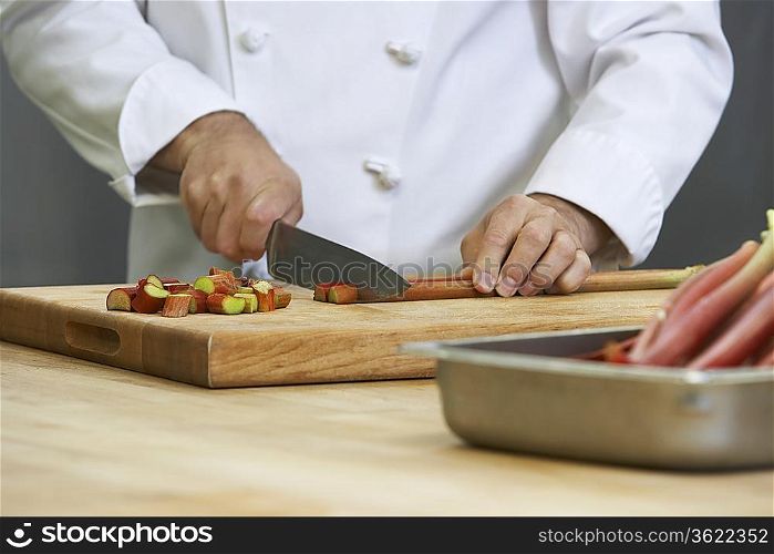 Chef chopping rhubarb, close-up