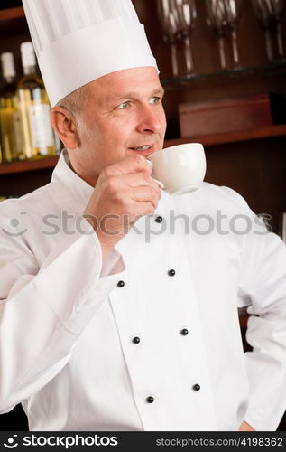 Chef cook relax break enjoy cup of coffee in restaurant