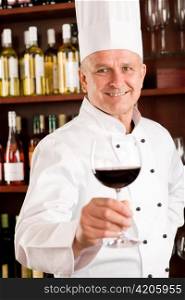 Chef cook wine bar professional hold glass confident in restaurant