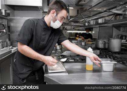 Chef cooking in modern industrial kitchen. High quality photo. Chef cooking in modern industrial kitchen.