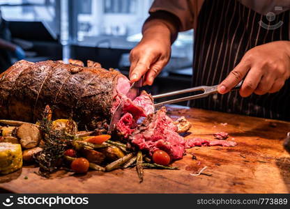 Chef cut Wagyu beef roast prime rib, Carving food