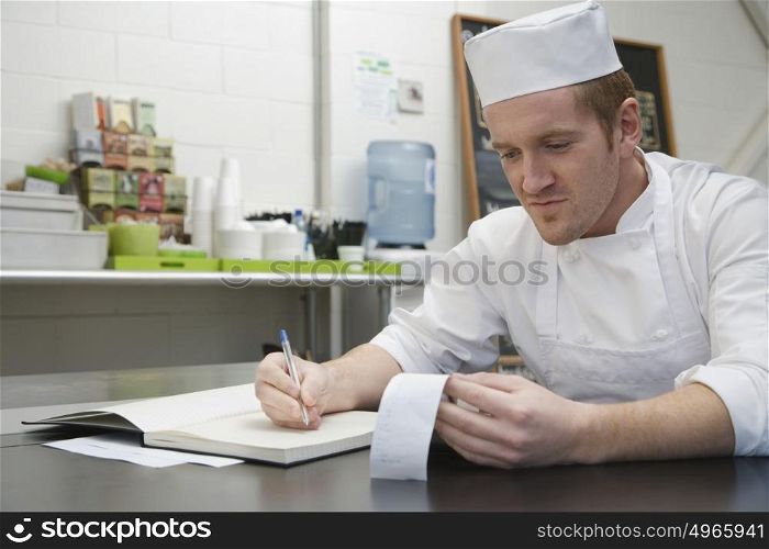 Chef doing accounts
