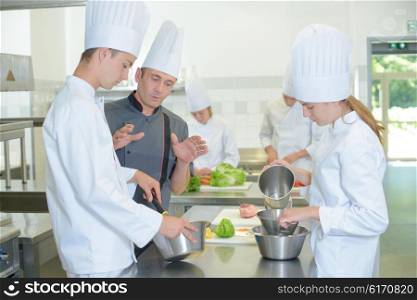 Chef explaining to trainees