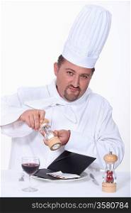 Chef getting ready to eat a laptop