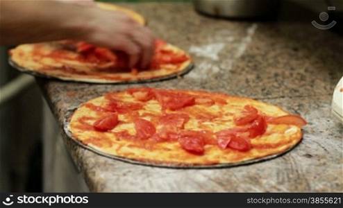 Chef Hand Making Italian Pizza.