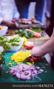 Chef hands cutting fresh and delicious vegetables for cooking or salad. Chef hands cutting fresh and delicious vegetables