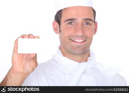 Chef holding a call card