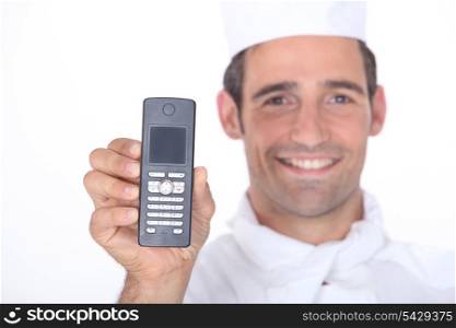 Chef holding a mobile phone