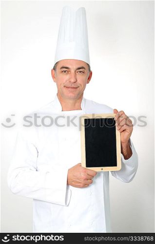 Chef holding black board for menu