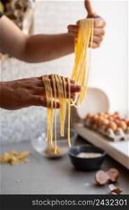 chef holding freshly made pasta