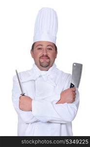 Chef holding meat cleaver and knife sharpener