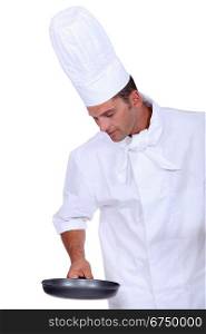 Chef holding saucepan