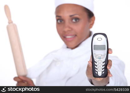 Chef holding up a telephone