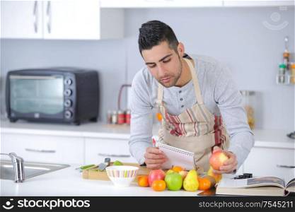 chef in apron preparing delicious fruit based recipe