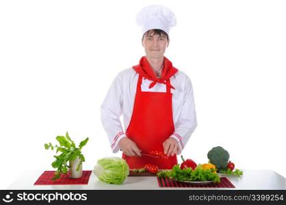 Chef in uniform cut tomatoes. Isolated on white background