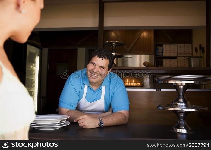 Chef interacting with customer