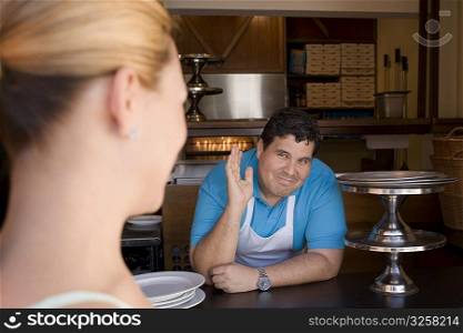 Chef interacting with customer