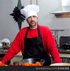 Chef man portrait with mustache in black and red on the kitchen