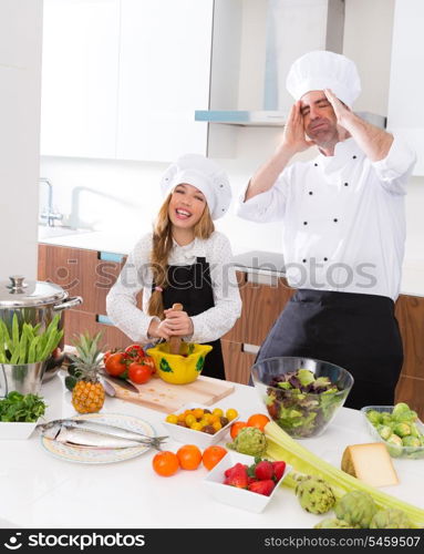 Chef master and junior kid girl at cooking school crazy man about pupil recipe