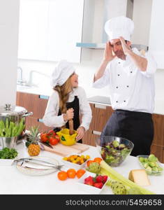 Chef master and junior kid girl at cooking school crazy man about pupil recipe