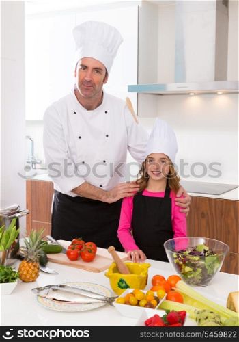 Chef master and junior pupil kid girl at cooking school with food on countertop
