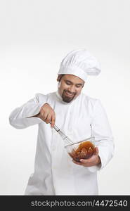 Chef mixing chocolate in a bowl