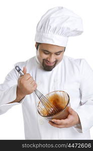 Chef mixing chocolate in a bowl