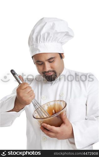 Chef mixing chocolate in a bowl