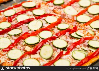 Chef preparing a delicious pizza with vegetables