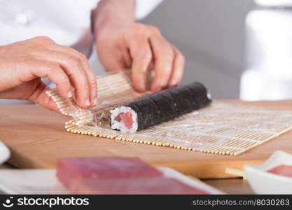 Chef preparing delicious sushi in a restaurant