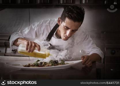 Chef preparing octopus recipe in kitchen with smoke and oil