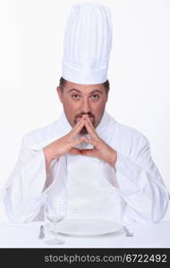 Chef sitting at a table