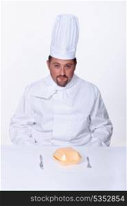 Chef sitting to eat a burger