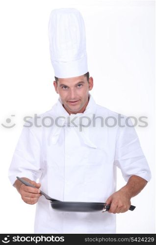 Chef stirring sauce