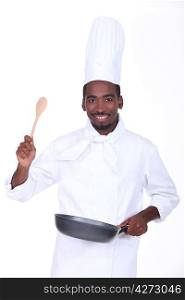 Chef with a pan and wooden spoon