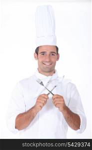Chef with crossed cutlery