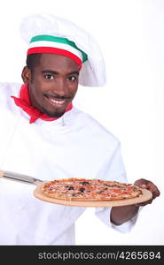 Chef with pizza on a wooden peel