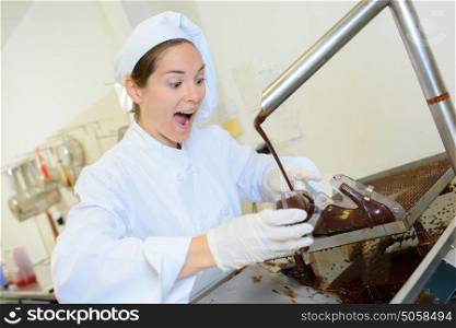 Chef working with melted chocolate, excited expression