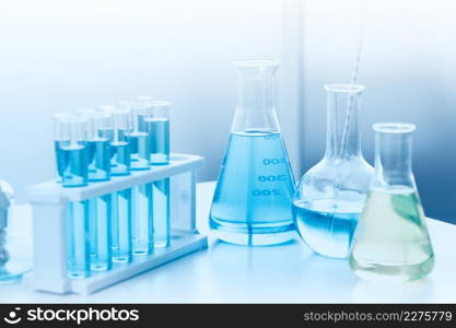 Chemecal equipment with liquid formular in science medical lab for research concept background