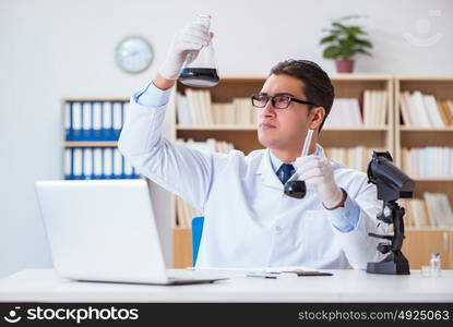 Chemical engineer working on oil samples in lab