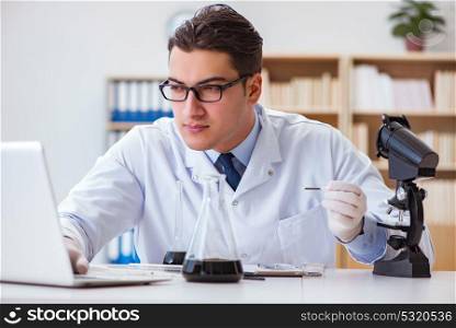 Chemical engineer working on oil samples in lab