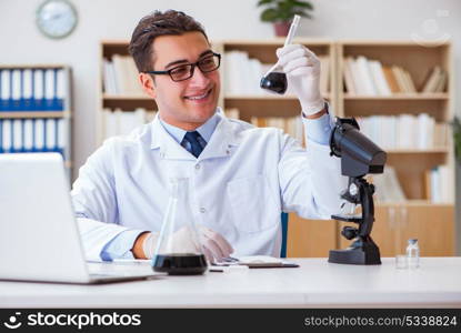 Chemical engineer working on oil samples in lab