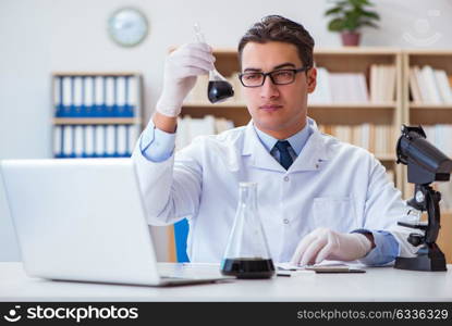 Chemical engineer working on oil samples in lab