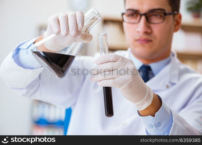 Chemical engineer working on oil samples in lab