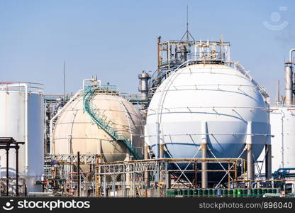 Chemical Factory plant with gas storage and structure of pipeline with smoke from smokestack in Kawasaki City near Tokyo Japan